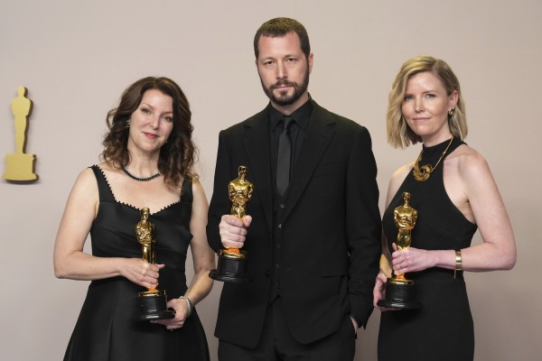 Ukraine's first Oscar hailed as reminder of war's horrors as Russian drones strike buildings