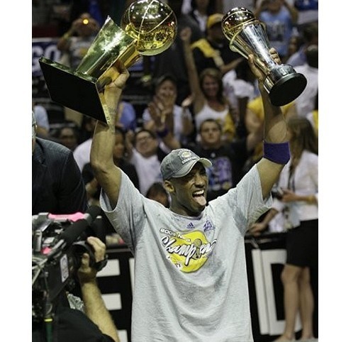 Pau Gasol embraces the NBA Championship trophy.jpg