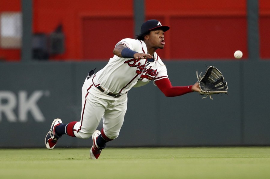 Braves use power, bullpen to hold of Dodgers