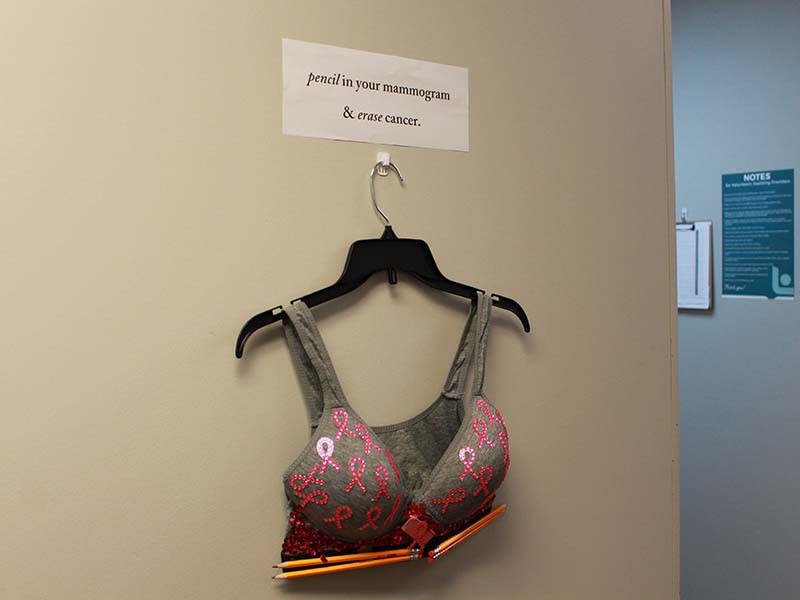Good News Clinics staff decorate bras for Breast Cancer